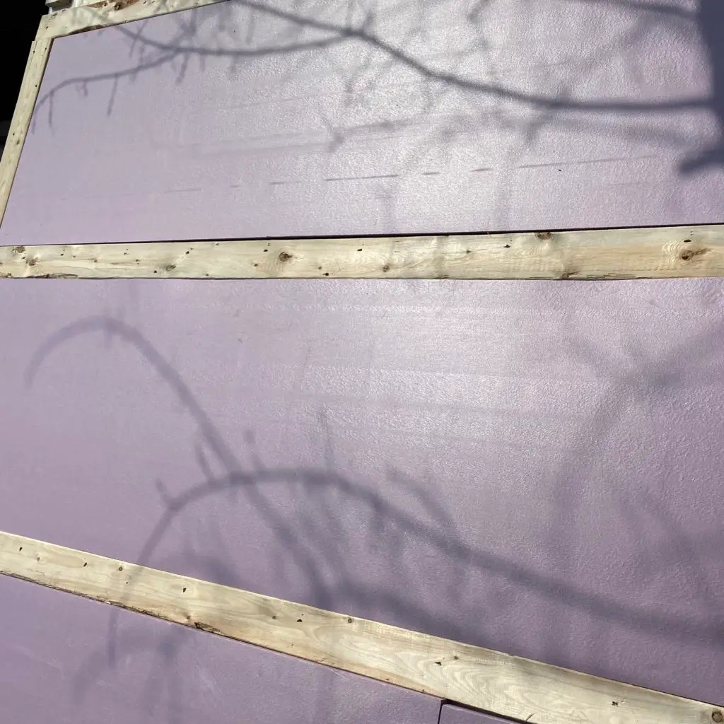 PL glue rigid foam insulation to plastic and cover with roof paneling